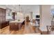 Bright kitchen open to living area featuring stainless appliances, island, and hardwood floors at 355 Cooper River Dr, Mount Pleasant, SC 29464