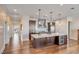 Contemporary kitchen with island, marble countertops, stainless steel appliances, and hardwood flooring at 355 Cooper River Dr, Mount Pleasant, SC 29464