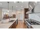 Modern kitchen featuring large island, stainless steel range hood and marble countertops at 355 Cooper River Dr, Mount Pleasant, SC 29464