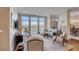Bright and airy living room featuring large windows offering scenic waterfront views at 355 Cooper River Dr, Mount Pleasant, SC 29464