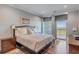 Serene bedroom featuring a king-sized bed and a private balcony with water views at 355 Cooper River Dr, Mount Pleasant, SC 29464