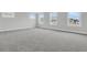 Light-filled bedroom with multiple windows and carpet at 3725 Grange Cir, Summerville, SC 29486