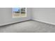 Simple bedroom with gray carpet and window at 3725 Grange Cir, Summerville, SC 29486