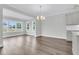 Bright dining room with hardwood floors and large windows at 3725 Grange Cir, Summerville, SC 29486