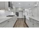 Modern kitchen with gray cabinets, quartz countertops, and farmhouse sink at 3725 Grange Cir, Summerville, SC 29486