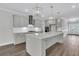 Modern kitchen with gray cabinets, quartz countertops, and large island at 3725 Grange Cir, Summerville, SC 29486