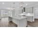 Modern kitchen with gray cabinets, quartz countertops, and large island at 3725 Grange Cir, Summerville, SC 29486