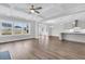 Open living room with hardwood floors and kitchen view at 3725 Grange Cir, Summerville, SC 29486
