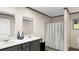 Bathroom featuring double sink vanity with modern fixtures and walk-in shower at 380 Dike Rd, Bonneau, SC 29431