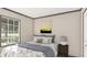 Comfortable bedroom featuring large window, neutral walls, and stylish décor at 380 Dike Rd, Bonneau, SC 29431