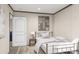 Stylish bedroom with metal frame bed, rug, and natural light at 380 Dike Rd, Bonneau, SC 29431