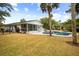 Home with a large backyard, screened porch, pool, and fire pit at 3906 Waterway Blvd, Isle of Palms, SC 29451