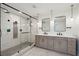Modern bathroom with double vanity and glass shower at 3906 Waterway Blvd, Isle of Palms, SC 29451
