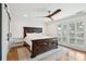 Bedroom with dark wood bed frame and white shiplap walls at 3906 Waterway Blvd, Isle of Palms, SC 29451