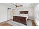 Charming bedroom with wood flooring and barn door at 3906 Waterway Blvd, Isle of Palms, SC 29451
