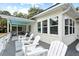Deck with white chairs and a view of the backyard at 3906 Waterway Blvd, Isle of Palms, SC 29451