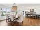 Bright dining room with a rustic wood table and chandelier at 3906 Waterway Blvd, Isle of Palms, SC 29451