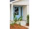 Stylish light blue front door entryway with brick accents at 3906 Waterway Blvd, Isle of Palms, SC 29451