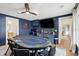 Game room with poker table, wet bar, and large TV at 3906 Waterway Blvd, Isle of Palms, SC 29451