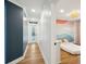 Bright hallway with hardwood floors and access to bedrooms at 3906 Waterway Blvd, Isle of Palms, SC 29451