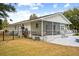 White house with screened porch, deck, and fenced backyard at 3906 Waterway Blvd, Isle of Palms, SC 29451