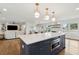 Open concept kitchen with island, breakfast bar, and Gathering room views at 3906 Waterway Blvd, Isle of Palms, SC 29451
