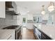 Bright kitchen with stainless steel appliances and blue tile backsplash at 3906 Waterway Blvd, Isle of Palms, SC 29451