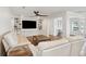 Relaxing living room with white sofas and built-in shelving at 3906 Waterway Blvd, Isle of Palms, SC 29451