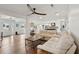 Spacious living room with light leather sofas and hardwood floors at 3906 Waterway Blvd, Isle of Palms, SC 29451