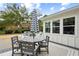Patio with round dining table and striped umbrella at 3906 Waterway Blvd, Isle of Palms, SC 29451