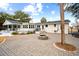 Large brick patio with fire pit and access to backyard at 3906 Waterway Blvd, Isle of Palms, SC 29451