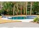 Inviting kidney-shaped pool with spa and lounge chairs at 3906 Waterway Blvd, Isle of Palms, SC 29451