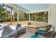 Relaxing screened porch with comfy seating and a view of the backyard at 3906 Waterway Blvd, Isle of Palms, SC 29451