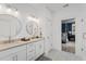 Main bathroom with double vanity, a walk-in shower, and views into the bedroom at 391 Wappoo Trace Ln, Summerville, SC 29486