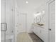 Elegant bathroom with double vanities, large mirrors, and a walk-in shower at 391 Wappoo Trace Ln, Summerville, SC 29486