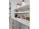 Built-in coffee bar with white quartz countertops and gray cabinets at 391 Wappoo Trace Ln, Summerville, SC 29486