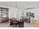 Open concept dining room with a rustic wooden table and kitchen view at 391 Wappoo Trace Ln, Summerville, SC 29486