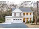 Two-story farmhouse with white siding, gray roof, and a two-car garage at 391 Wappoo Trace Ln, Summerville, SC 29486