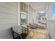 Charming front porch with black wicker chairs and side table at 391 Wappoo Trace Ln, Summerville, SC 29486