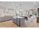 Open kitchen with gray cabinets, marble island, and stainless steel appliances at 391 Wappoo Trace Ln, Summerville, SC 29486