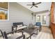 Screened porch with seating area and access to backyard at 391 Wappoo Trace Ln, Summerville, SC 29486