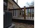Grey central AC unit next to a wooden deck with black railings at 402 Citadel St, Ladson, SC 29456