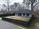 House with black fence, landscaping, and driveway at 402 Citadel St, Ladson, SC 29456