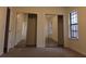 Bright bedroom featuring mirrored closet doors and carpet flooring at 402 Citadel St, Ladson, SC 29456