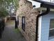 Brick and gray siding exterior with black gutters and landscaping at 402 Citadel St, Ladson, SC 29456