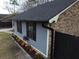 Gray siding exterior with black gutters and landscaping at 402 Citadel St, Ladson, SC 29456