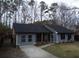 Newly painted house with screened porch and landscaping at 402 Citadel St, Ladson, SC 29456