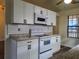 White kitchen with new appliances and granite countertops at 402 Citadel St, Ladson, SC 29456