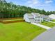Aerial view of two-story home with backyard and neighborhood at 4041 Oxeye Loop, Johns Island, SC 29455
