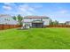 Large backyard with screened porch and lush grass at 4041 Oxeye Loop, Johns Island, SC 29455